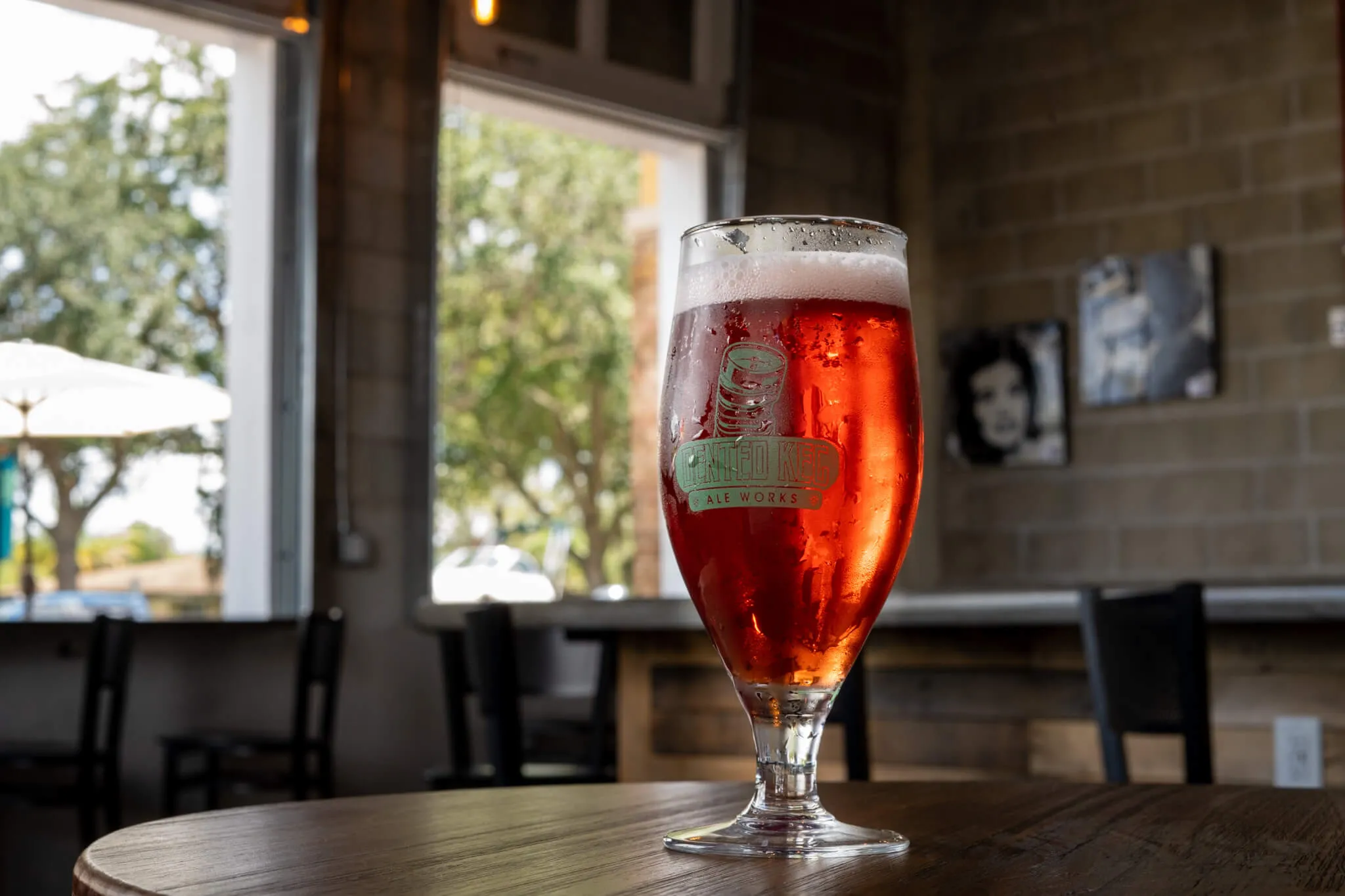Inside Dented Keg Ale Works, industrial decor with warm lighting